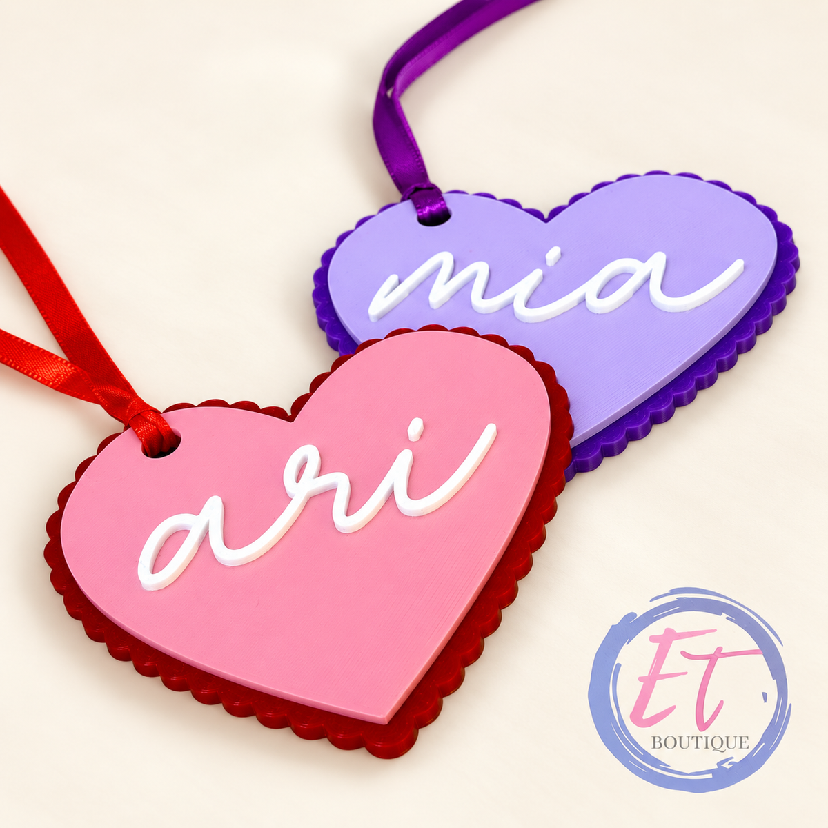 Pink and purple three-color personalized heart name tags with scalloped backing