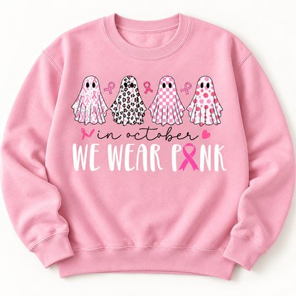 Pink ribbon patterned ghosts on a light pink crewneck sweatshirt